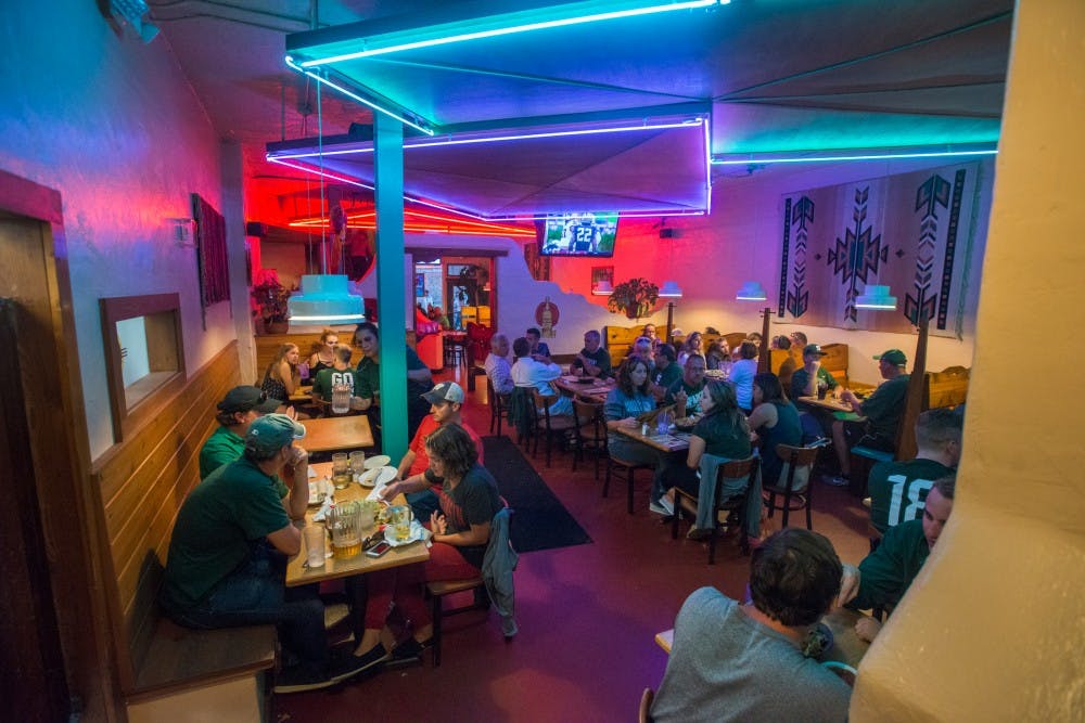 People gather and eat dinner on Sept. 24, 2016 on the first floor of El Azteco at 225 Ann St. El Azteco has been in business for 40 years.