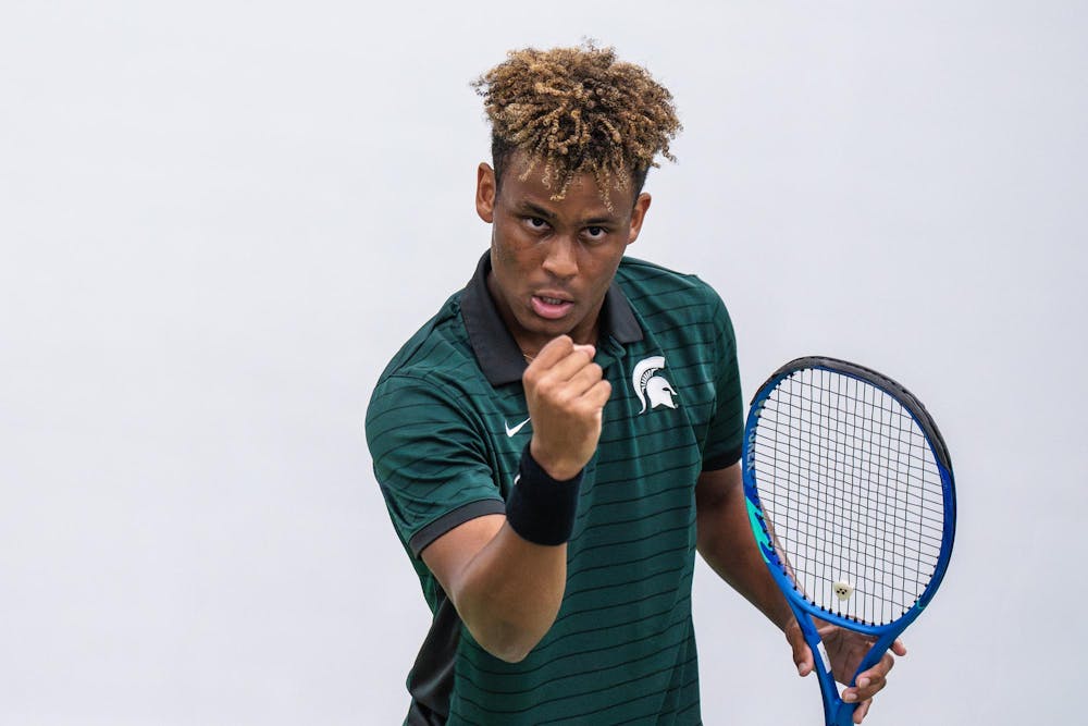 <p>Matthew Forbes, a sophomore on the Michigan State men’s tennis team, focuses on assistant coach Mike Flowers after scoring a point during a singles match at the MSU Tennis Center in Lansing, Mich., Sunday, April 19, 2026.</p>