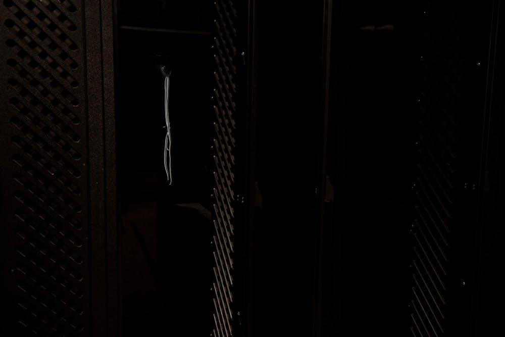 Goggles hang in an empty locker in the girls swim locker room in IM West Fitness Center on Wednesday April 24, 2024. 