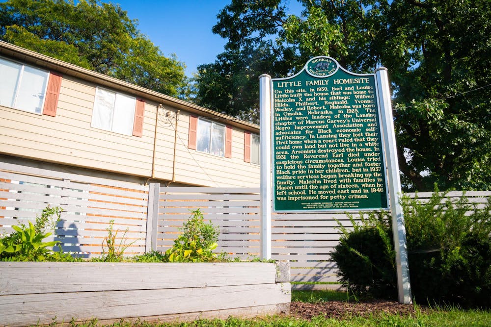 The Malcolm X Homesite Marker in Lansing, MI on Sep. 19, 2024. Townhomes loom in the background, where X's home stood until 1929.