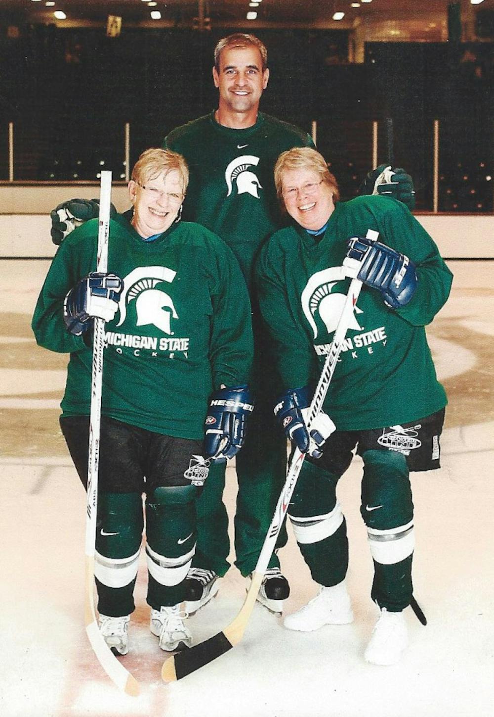 	<p><span class="caps">MSU</span> &#8220;super fan&#8221; Janeen Geisenhaver, right, and her so-called &#8220;partner in crime&#8221; Pam Echterling pose with <span class="caps">MSU</span> ice hockey coach Tom Anastos at a women&#8217;s hockey clinic last summer. Geisenhaver was named <span class="caps">MSU</span>&#8217;s super fan in a contest held by the <span class="caps">CCHA</span>.</p>