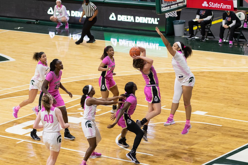 Taiyier Parks jumps to block a shot from Purdue in Michigan State's victory on Feb. 21, 2021.