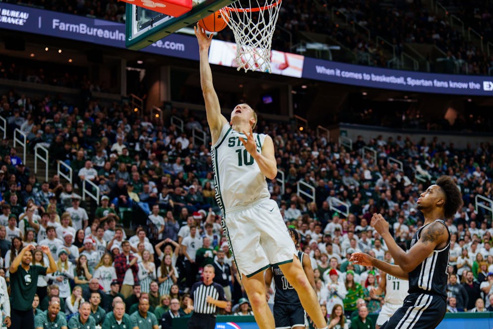 <p>Graduate Student guard Joey Hauser (10) goes for a layup in a game against Brown, held at the Breslin Center on Dec. 10, 2022. The Spartans defeated the Bears 68-50.</p>