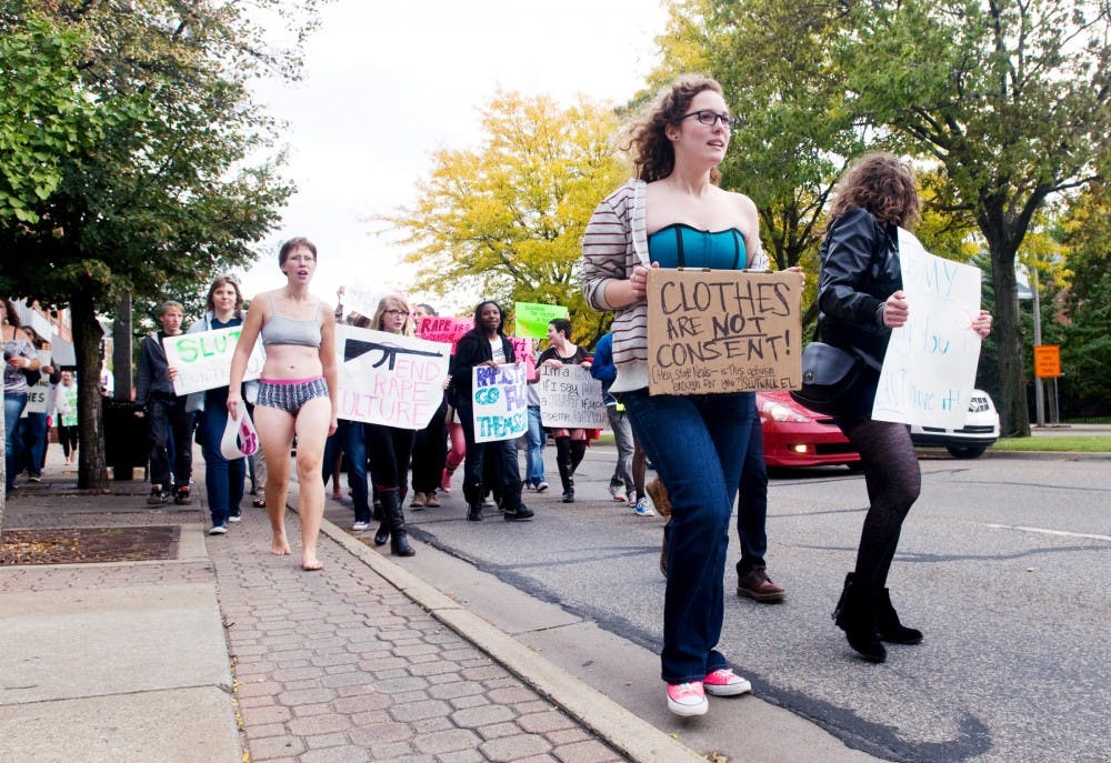 Protestors march in and along Grand River Avenue Friday as a part of Slutwalk. Slutwalk is a protest organized to speak out again sexual violence and rape culture. Matt Radick/The State News