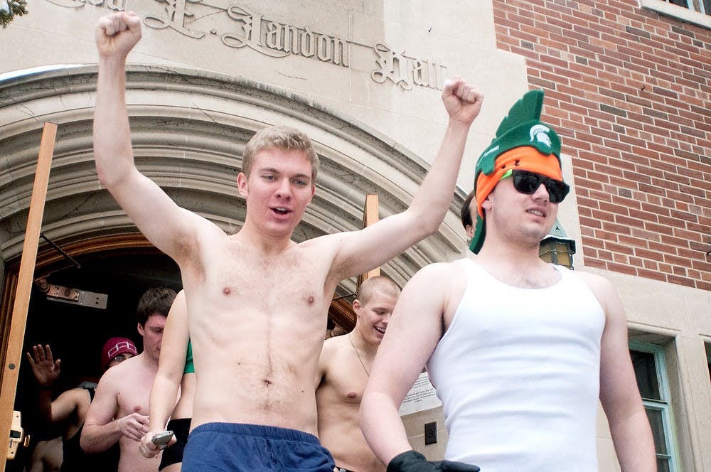 	<p>Biochemistry and molecular biology senior Daniel Buhlinger, left, and international relations sophomore Eric Neustadt run out of the doors of Landon Hall on Friday, Feb. 22, 2013, at the Stride for Pride run.  The students who participated ran around West Circle in as little or as much clothing as they wanted. </p>