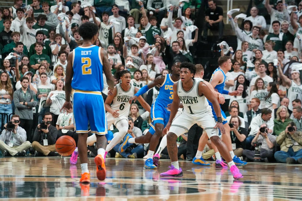 Michigan State sophomore guard Jeremy Fears Jr. and freshman guard Jordan Scott (6) play defense against UCLA at the Breslin Center in East Lansing, Michigan, on Tuesday, Feb. 17, 2026.