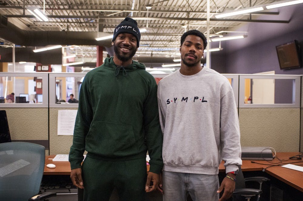 <p>Michigan State University alumni Matthew Eleweke (left) and Mark Meyers pose for a picture on Feb. 6, 2018 at The State News. Matthew and Mark developed an app called SYMPL, the app was developed to make group work and projects easier.</p>