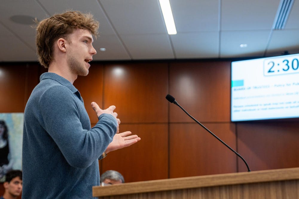 <p>Grayson Eckland, a Michigan State student a part of the Green Promise Project and Spartan Sierra Club, speaks to the MSU Board of Trustees regarding campus wide decarbonization infrastructure at Hannah Administration Building in East Lansing, Michigan on Friday, April 10, 2026.</p>