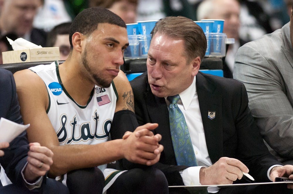 <p>Head coach Tom Izzo talks to sophomore guard Denzel Valentine on March 22, 2014, at Spokane Veterans Memorial Arena in Spokane, Wash., during the game against Harvard in the NCAA Tournament. MSU won, 80-73. Betsy Agosta/The State News</p>