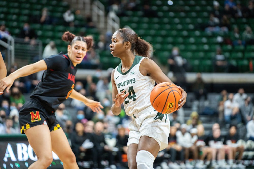 <p>Senior guard Nia Clouden (24) dribbles against a Maryland player. MSU lost to Maryland at the Breslin Center 67-62 on Thursday, Feb. 3, 2022.</p>