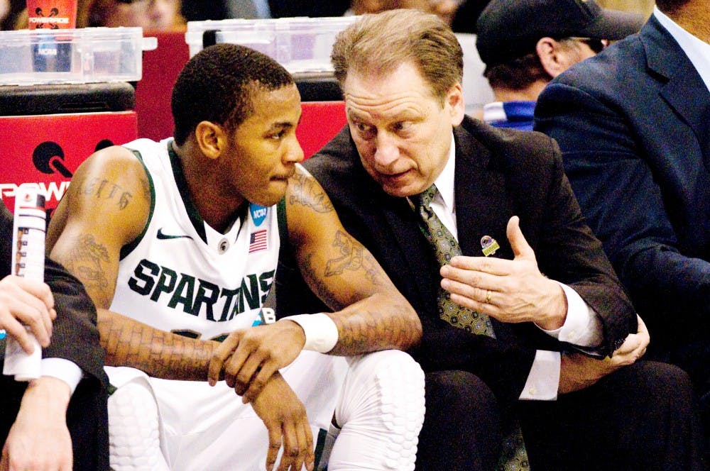 Head coach Tom Izzo speaks with sophomore guard Keith Appling Thursday night at US Airways Center in Pheonix, Az. Appling put up six points for the Spartans in the 57-44 defeat to Louisville. Matt Hallowell/The State News