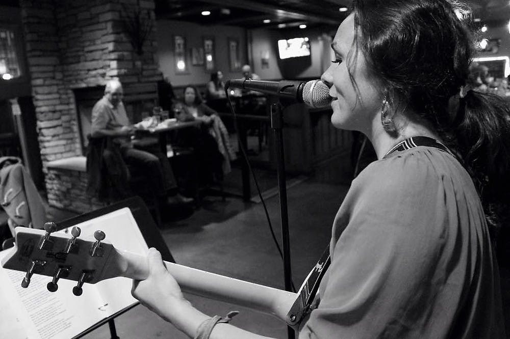 <p>Advertising senior Sarah Brunner performs at Craftsmam Chop Company in Portage, Michigan. Photo Credit: Mandi Fu</p>