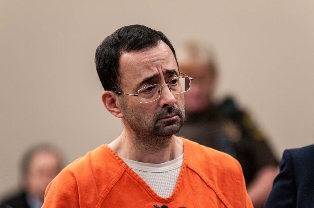 <p>Larry Nassar listens to the judge during the plea hearing on Nov. 22, 2017, at the Veterans Memorial Court at 313 W Kalamazoo St., Lansing. Nassar pleaded guilty to seven counts.</p>