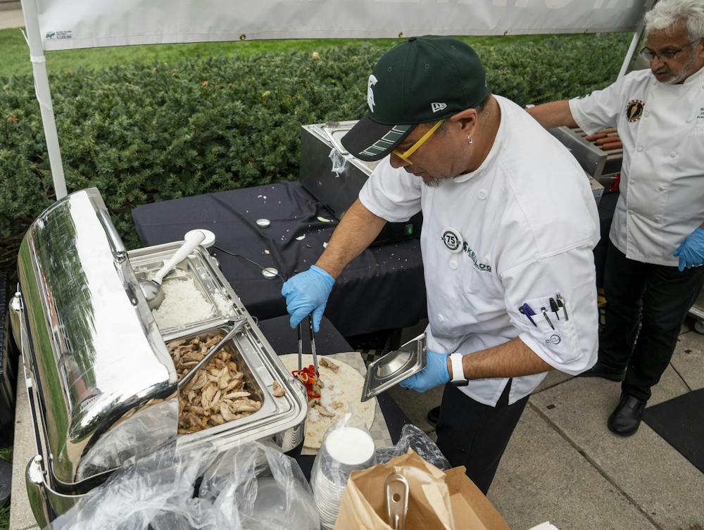 <p>MSU Culinary Services Senior Executive Chef of Retail Dining Ben Segueda prepares a burrito for a customer in the MSU Union courtyard in East Lansing, Mich., on Wednesday, Sept. 16, 2026.</p>