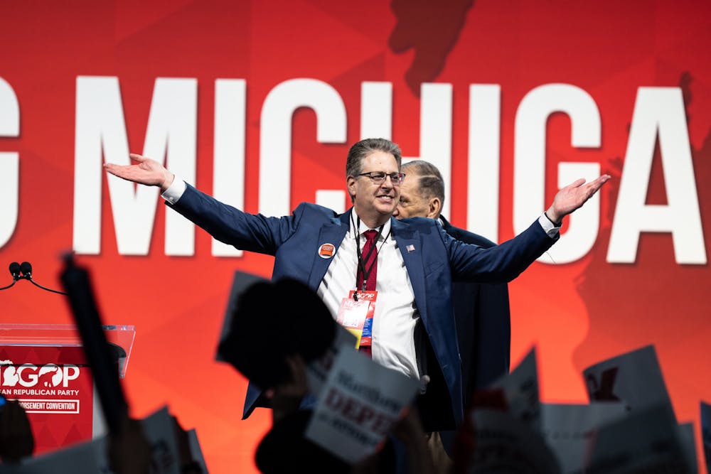 <p>Matthew Deperno, a candidate for Attorney General, basks in the cheers during his campaign at the MI GOP Endorsement Conference on April 23, 2022.</p>