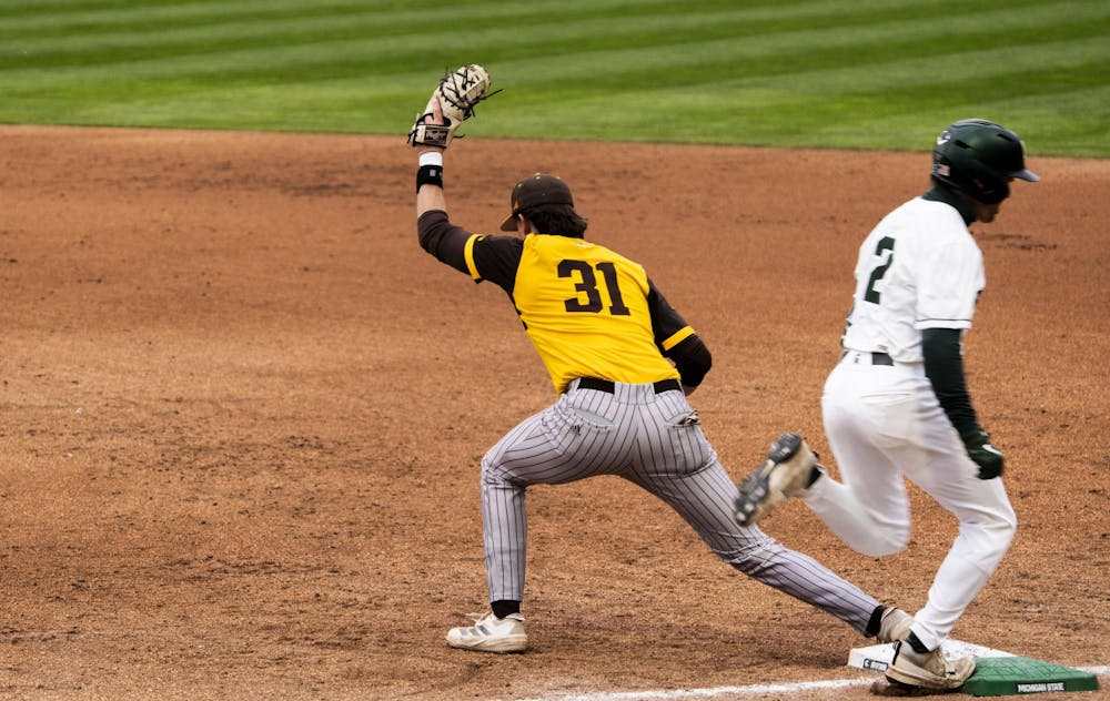 <p>Western Michigan junior corner infielder Avery Thielman (31) gets to first base before MSU senior outfielder JT Sokolove (2) at McLane Stadium on April 15, 2025. The Spartans defeated the Broncos 14-4.</p>