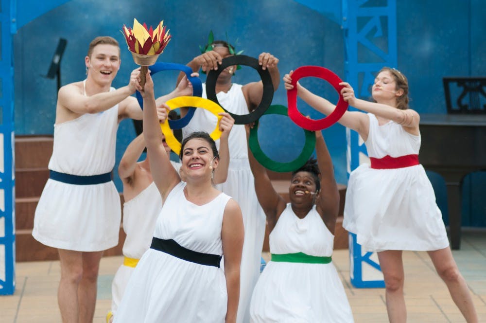 The cast of the Summer Circle Theater's production of Mount Olympus Junior High raise their rings on June 9, 2016 at the Summer Circle Courtyard.  The show depicts young gods experiencing the struggles and awkwardness of middle school.
