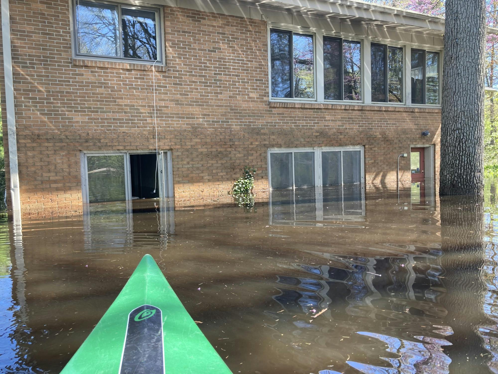 <p>Photo courtesy of MSU student Megan Arlt. The outside view of a rental home in Midland as Arlt kayaked through the flood water. </p>