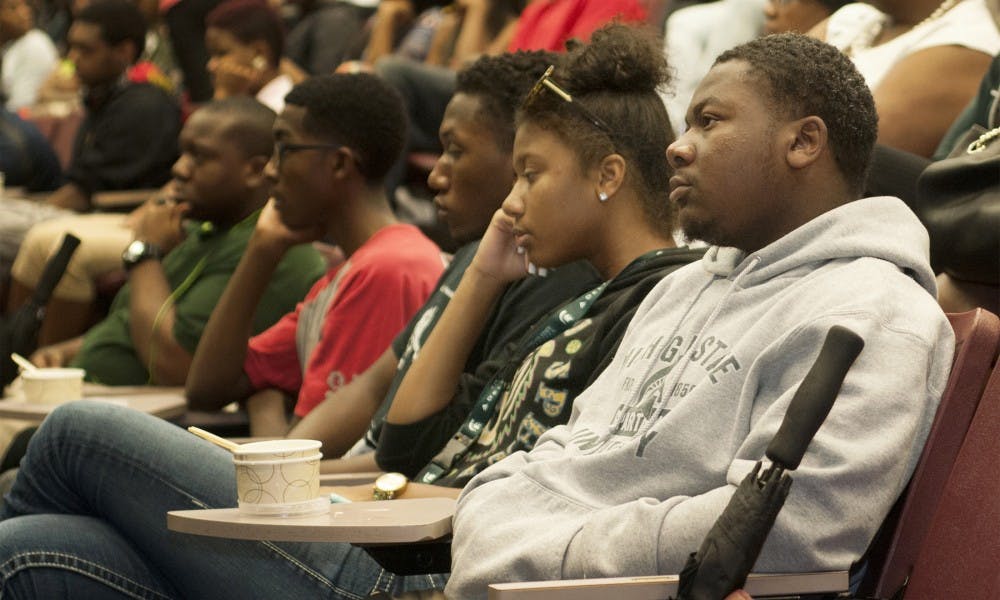 <p>Interdisciplinary studies in social science and social science education freshman Jonathan Miller II, right, and biomedical laboratory science freshman Kennedi Wesley listen to speakers Sept. 5, 2015, at the Black Student Welcome presented by the Black Student Alliance at the Business College Complex. "I really like the saying that we are not minority, but we are minoritized," Wesley said.  Joshua Abraham/ The State News</p>