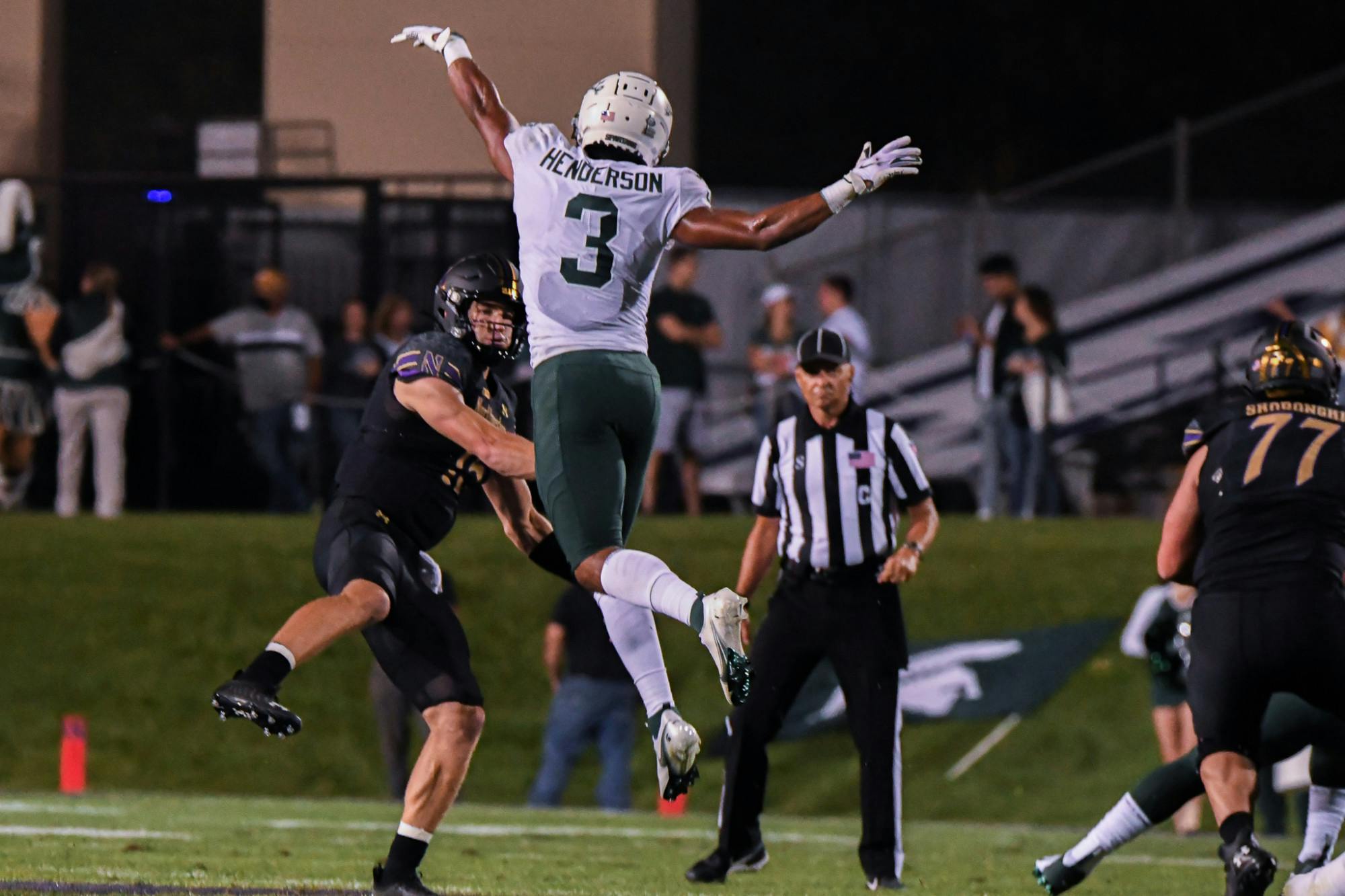 <p>Senior saftey Xavier Henderson disrupts the throw during the Spartans’ game at Northwestern on Sept. 3, 2021.</p>