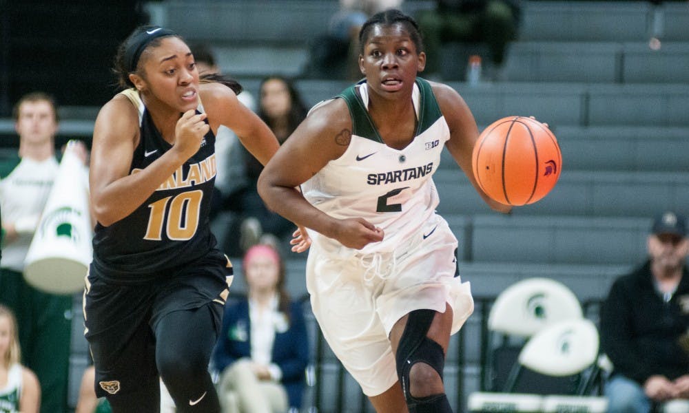 Sophomore forward Mardrekia Cook (2) dribbles the ball down the court as Oakland guard Taylor Jones (10) follows during the game against Oakland on Nov. 13, 2017, at Breslin Center. The Spartans defeated the Grizzlies 95-63.
