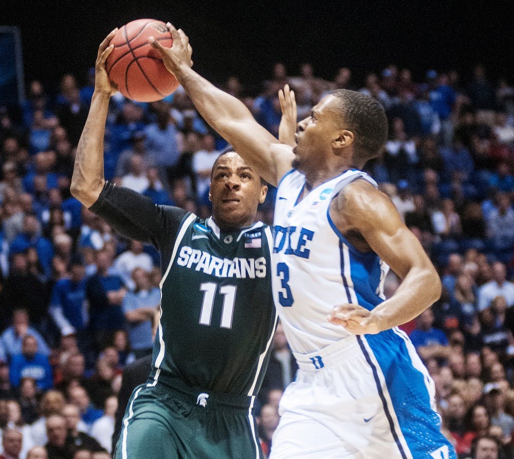 	<p>Junior guard Keith Appling is blocked by Duke guard Tyler Thornton on Friday, March. 29, 2013, at Lucas Oil Stadium in Indianapolis, Ind. The Duke Blue Devils defeated the Spartans, 71-61, in the Sweet Sixteen of the <span class="caps">NCAA</span> Tournament and now advance to the Elite Eight. Adam Toolin/The State News</p>