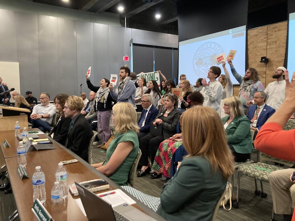 Hurriya Coalition student activists interrupted the Flint Board of Trustees meeting on June 28, 2024. 