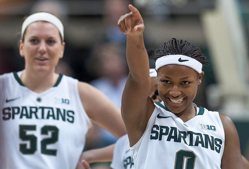 	<p>Sophomore guard Kiana Johnson cheers at the final minutes of the game. She contributed 17 points for <span class="caps">MSU</span>. The Spartans defeated the Gophers, 66-51, Thursday, Jan. 3, 2012, at Breslin Center. Justin Wan/The State News</p>