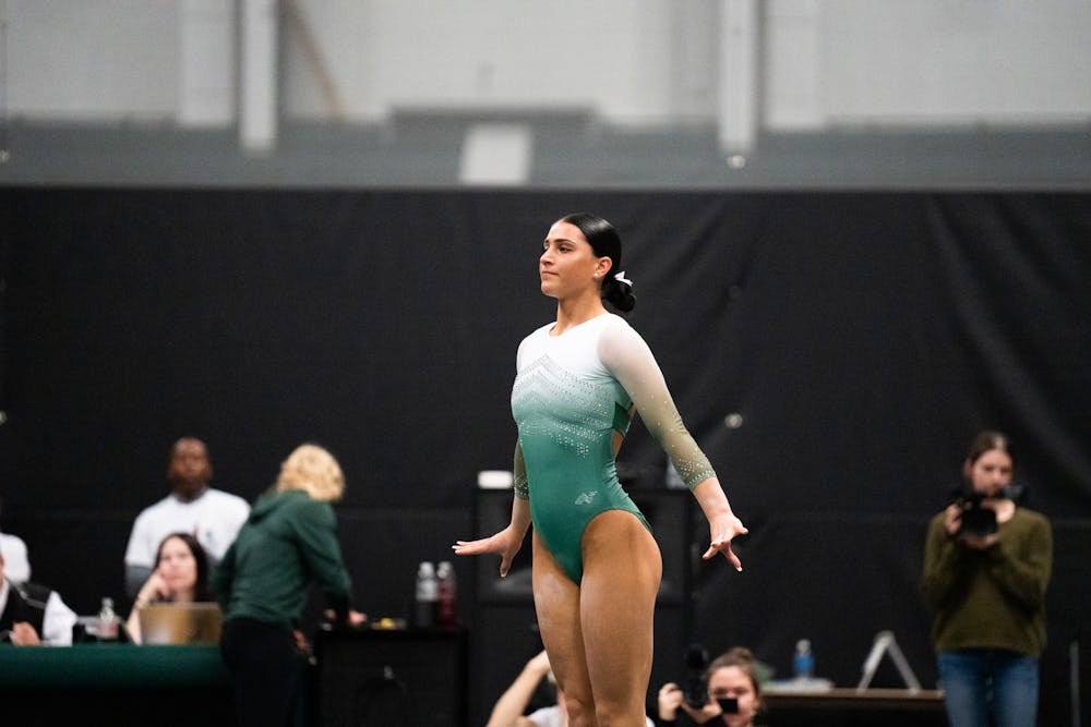 <p>Junior All-Around Delanie Harkness after finishing her dismount at the MSU vs. Penn State meet at the Jenison Field House on Feb. 4, 2023. The Spartans beat the Nittany Lions 197.450 - 195.475.</p>