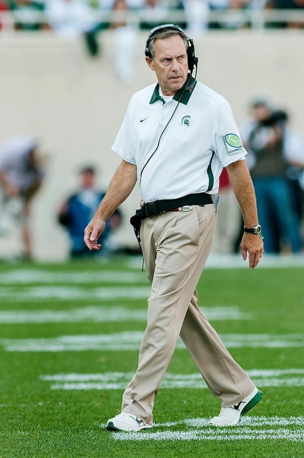 <p>Spartans head coach Mark Dantonio walks off the field after an MSU timeout during the Ohio State game on Saturday afternoon, Sept. 29, 2012, at Spartan Stadium. The Buckeyes beat the Spartans 17-16. Natalie Kolb/The State News</p>