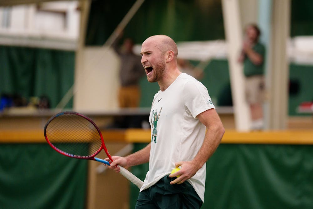 Michigan State Fifth Year Senior Anthony Pero celebrates during a matchup against Ball State, held at the MSU Tennis Center on Feb. 3, 2023. The Spartans defeated the Cardinals 4-3. 