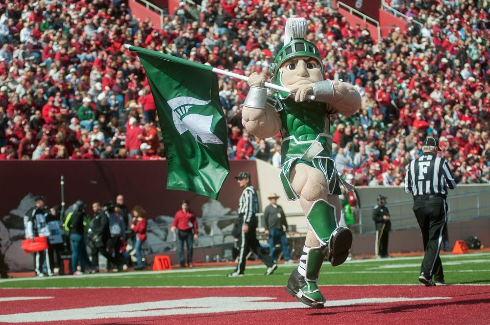 	<p>Spartan mascot Sparty runs down the field with a flag in hand during the Indiana game on Saturday afternoon, Oct. 6, 2012, at Memorial Stadium in Bloomington, Ind. The Spartans beat the Hoosiers, 31-27. Natalie Kolb/The State News</p>