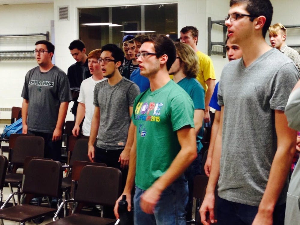 <p>Mechanical engineering senior Pat Frahm&nbsp;and Media and Information Junior Caleb Ford sing Franz Peter Schubert’s ‘Widerspruch’ during Men’s Glee rehearsal on Thursday.</p>