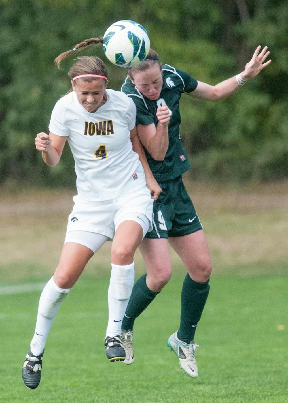 	<p>Senior midfielder Jordan Mueller competes for the ball with Iowa player Allie Adam. The Spartans tied with the Hawkeyes, 0-0, on Sunday, Sept. 30, 2012 at DeMartin Stadium. Justin Wan/The State News</p>