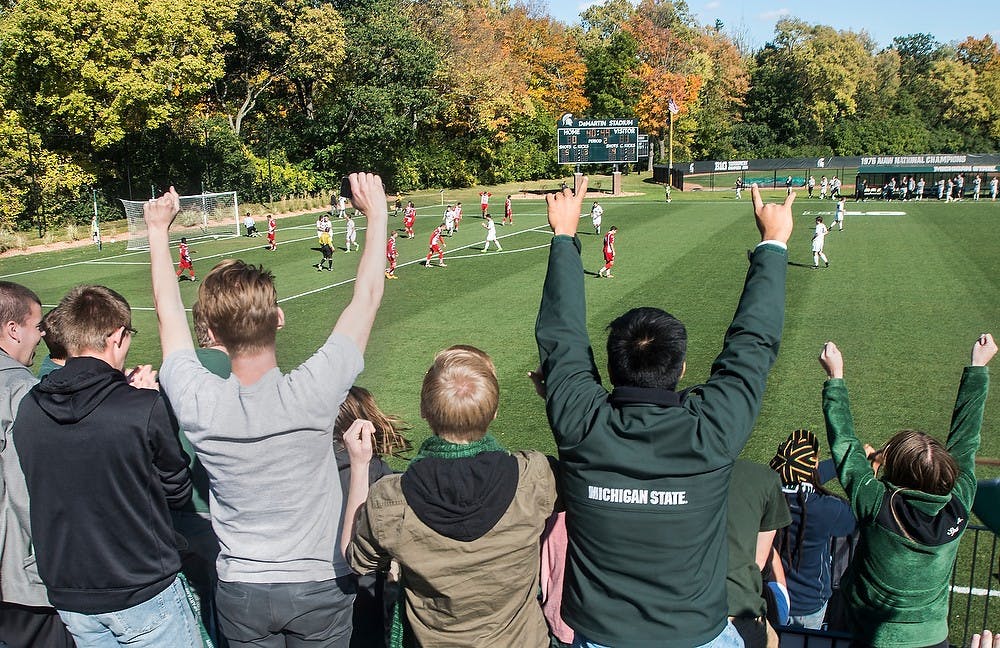 <p>The Red Cedar Rowdies cheer for the Spartans Oct. 11, 2014, during a game against Wisconsin at DeMartin Soccer Stadium at Old College Field. The Spartans defeated the Badgers, 2-1. Erin Hampton/The State News</p>