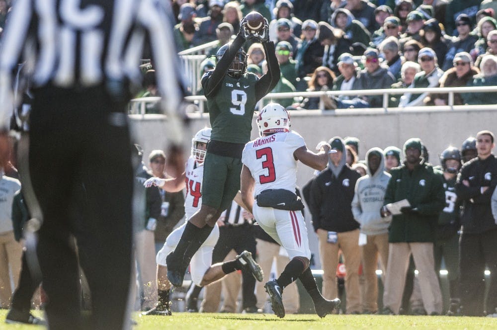 Junior safety Montae Nicholson (9) intercepts the ball during the game against Rutgers on Nov. 12, 2016 at Spartan Stadium. The Spartans defeated the Scarlet Knights, 49-0.