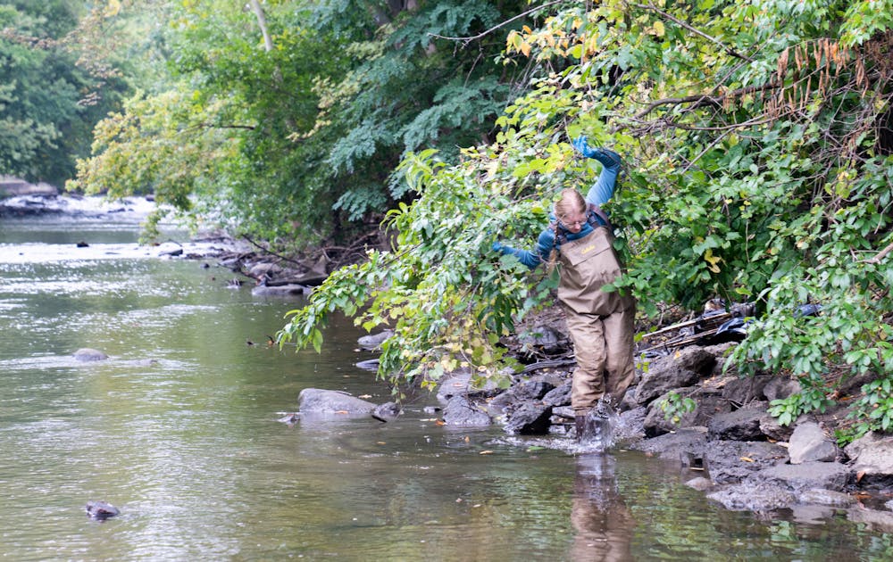 <p>MSU Outdoor Club members clean up the Red Cedar river on Sept. 25, 2022. Members put their waders and gloves on, grabbed a trash bag and headed into the river at 10 a.m. </p>