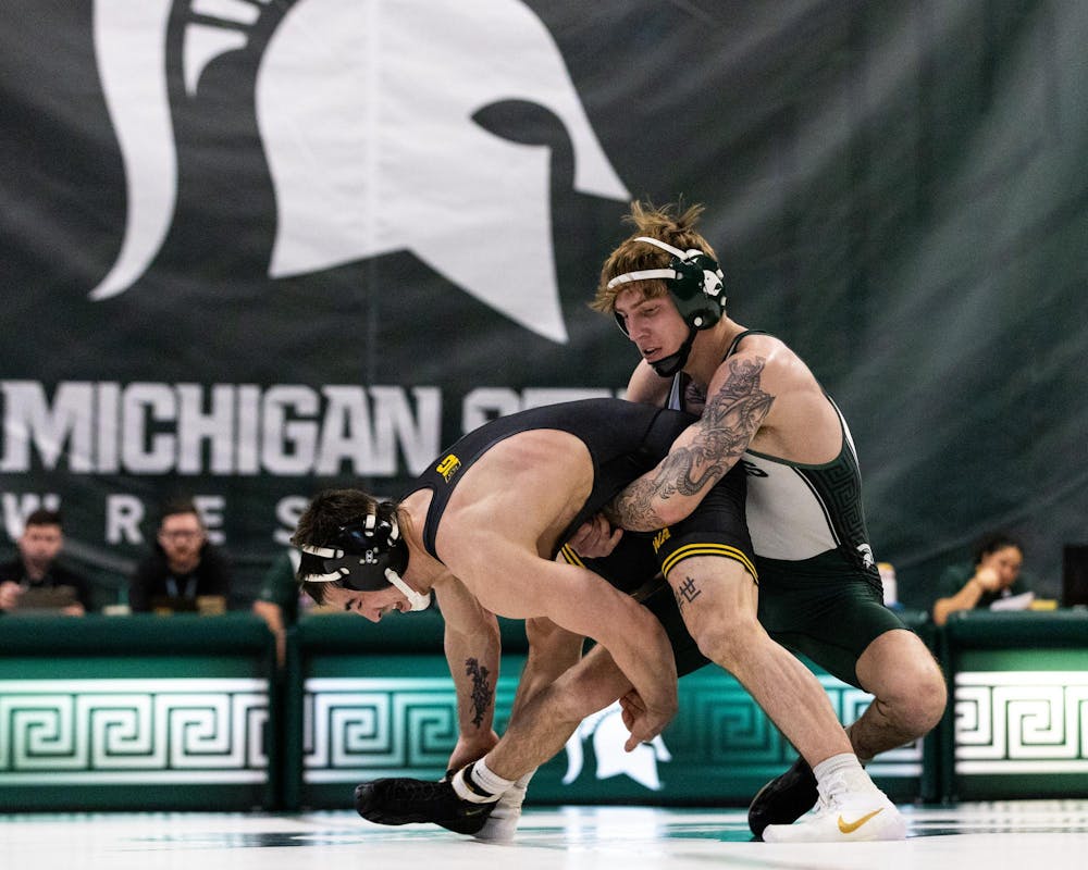 MSU R-Jr. Wt. 125, Nick Corday, tries to pull down an Iowa wrestler in Jenison Field House in East Lansing, MI on Feb. 8, 2026.