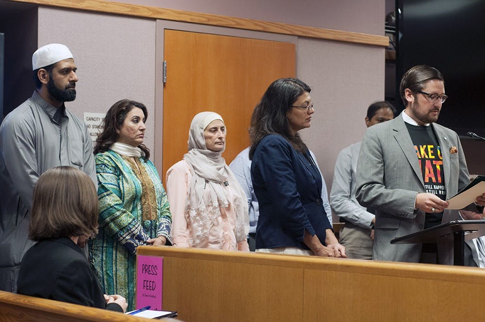 <p>Mayor Nathan Triplett and Rashida Tlaib present a resolution agreeing to support the campaign to Take on Hate inside East Lansing City Hall on August 4, 2015. The campaign is committed to eliminating hate and discrimination and protect all families of citizens of East Lansing not matter religion and ethnicity. Joshua Abraham/The State News</p>