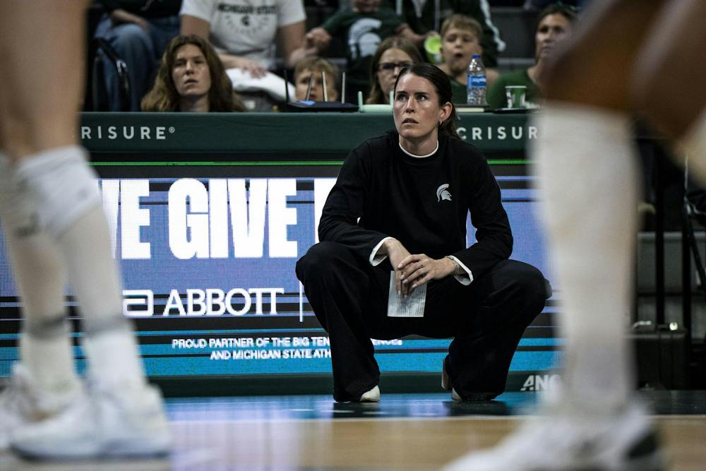 Michigan State volleyball head coach Kristen Kelsay watchs her team play during a match at the Breslin Center in East Lansing, Mich., on Friday, Sept. 2026.