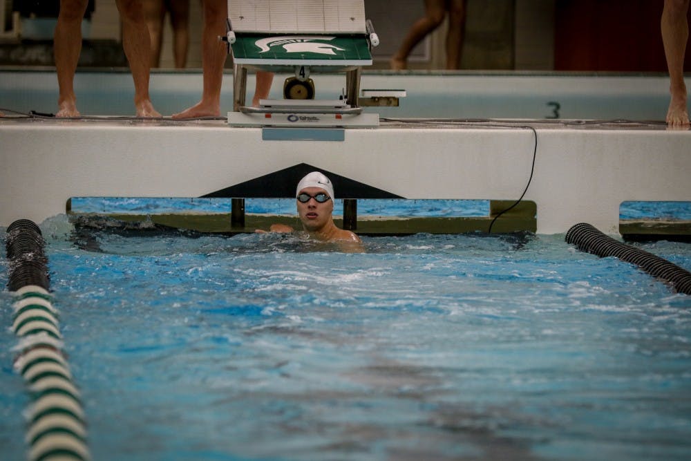<p>Payton Woods sits in the pool during a meet against Purdue on Jan. 11 at IM West. Woods and teammate Scott Piper both made cuts to the 2020 Olympic Trials. Photo courtesy of MSU Athletic Communications</p>
