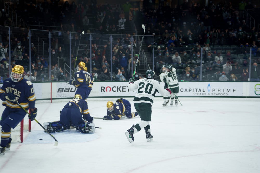 <p><br/><br/></p><p>Michigan State junior Josh Nodler running to celebrate with junior Erik Middendorf after he scores the first goal of the game on Feb. 18, 2022. Spartans lost 2-1 against Notre Dame.</p><p><br/><br/><br/><br/><br/><br/></p>