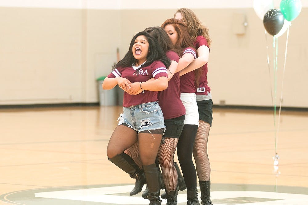 <p>Advertising junior Koraima Guillen leads her Lambda Theta Alpha Latin Sorority, Inc. sisters in a chant March 27, 2015, during the Multicultural Greek Showcase at IM West. The girls performed to commemorate their founders and the tradition of their sorority. Kennedy Thatch/The State News</p>
