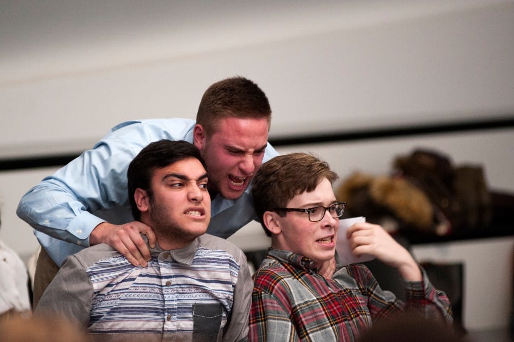Theatre freshman Raied Jawhari, left, and theatre freshman Grant Cleaveland, right, get yelled at by media and information senior Jake Samson, center, during a rehearsal on Feb. 5, 2016 at the Eli and Edythe Broad Art Museum. 