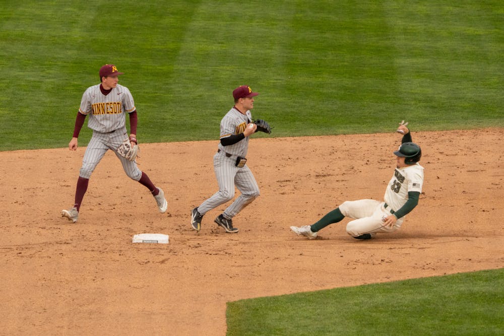 <p>Junior outfielder Casey Mayes (33) slides into second base but gets out. MSU beat the University of Maryland 2-1 on April 30, 2022.</p>