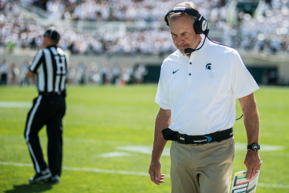 <p>Head coach Mark Dantonio shows emotion during the game against Bowling Green on Sep. 2, 2017, at Spartan Stadium. The Spartans defeated the Falcons, 35-10.</p>