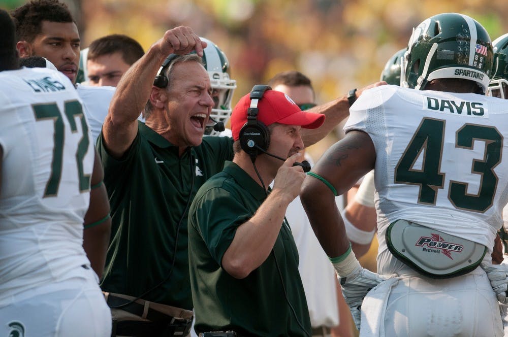 <p>Head coach Mark Dantonio yells at his team during a timeout during the game against Oregon on Sept. 6, 2014, at Autzen Stadium in Eugene, Ore. The Spartans lost to the Ducks, 46-27. Julia Nagy/The State News</p>