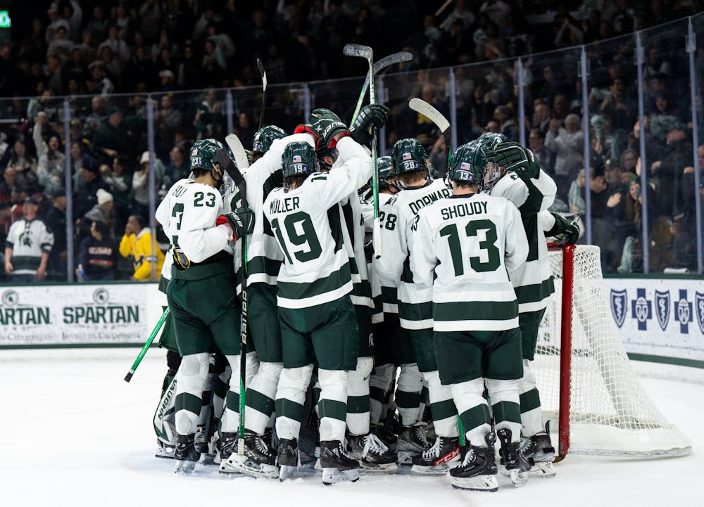 <p>The MSU men&#x27;s hockey team celebrates their victory against the University of Michigan ﻿at Munn Ice Arena on Dec. 9, 2022. The Spartans defeated the Wolverines 2-1. </p>