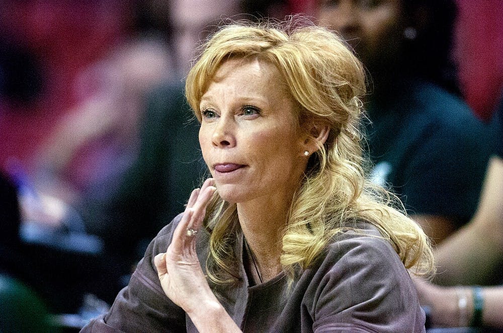 	<p>Head coach Suzy Merchant motions to her team during the first round of the <span class="caps">NCAA</span> Tournament on Saturday, March 23, 2013, against Marist at Comcast Center in College Park, Md. The Spartans defeated the Red Foxes, 55-47. Julia Nagy/The State News</p>