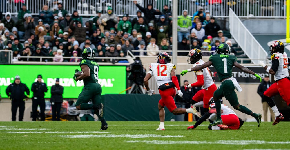 <p>Michigan State junior running back Kenneth Walker III runs the ball towards the end zone during Michigan State&#x27;s victory over University of Maryland on Nov. 13, 2021.</p>